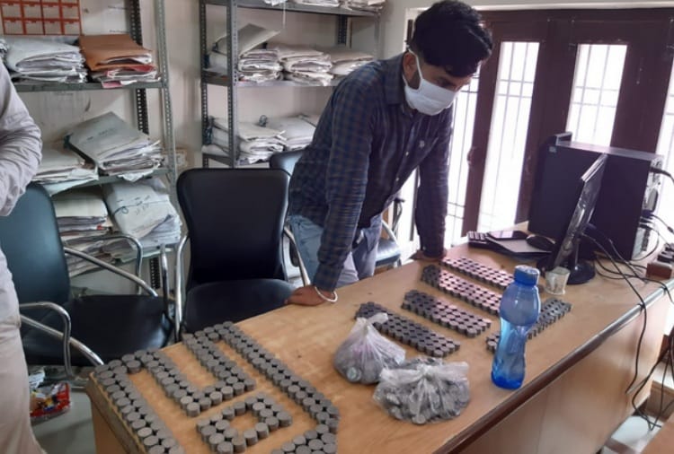 Man Deposit Coins for Property Tax Payment