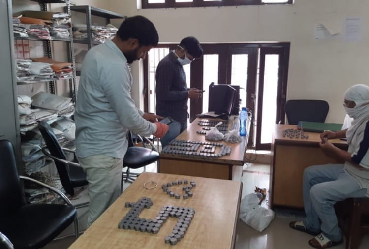 Man Deposit Coins for Property Tax Payment
