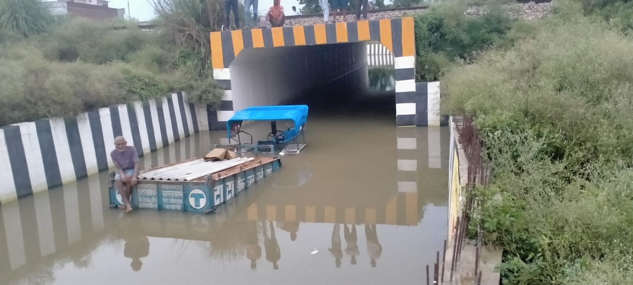 Tractor trapped in under-filled water
