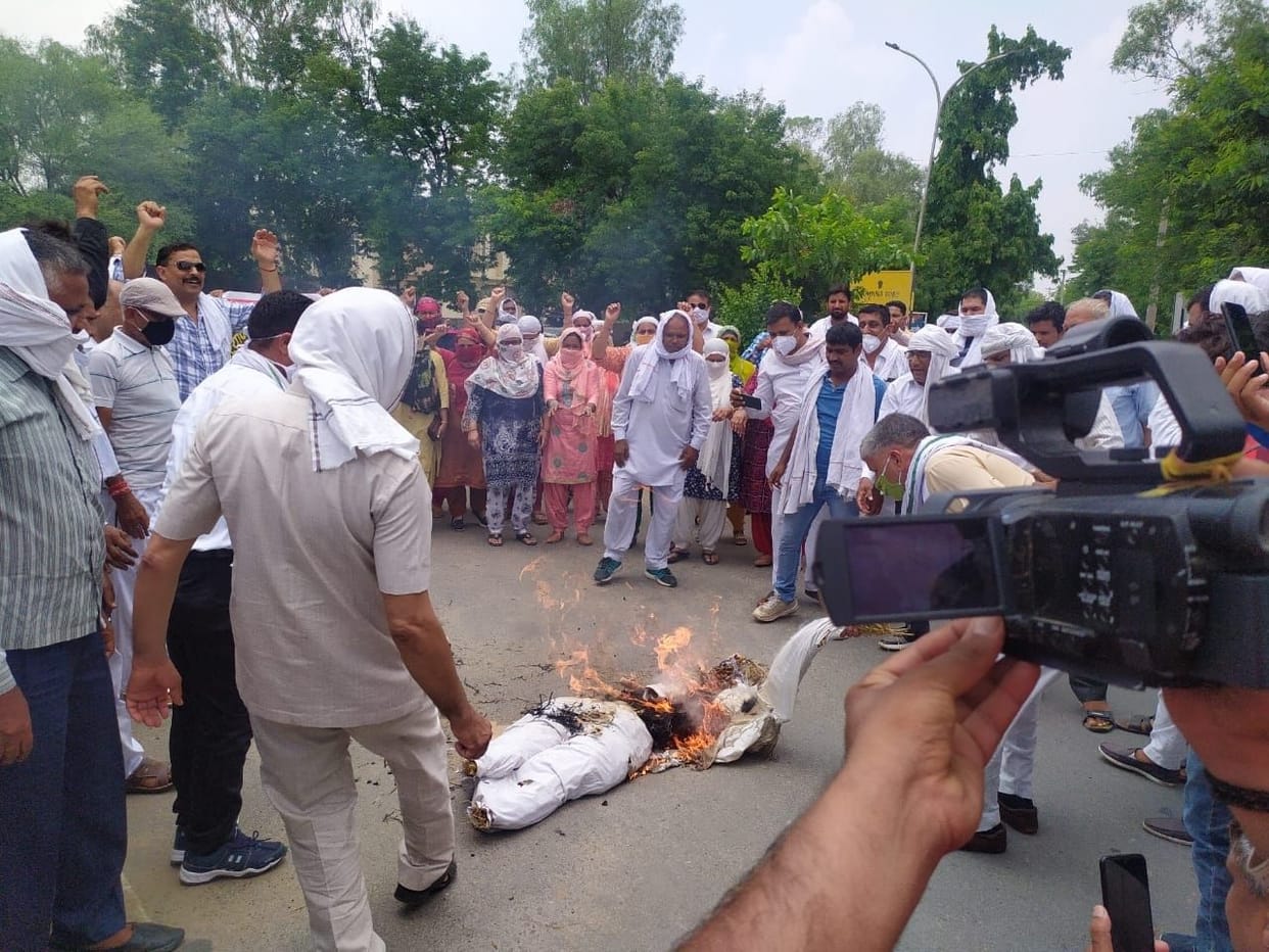 Teacher's union expresses fury by burning effigy for job restoration of physical teachers