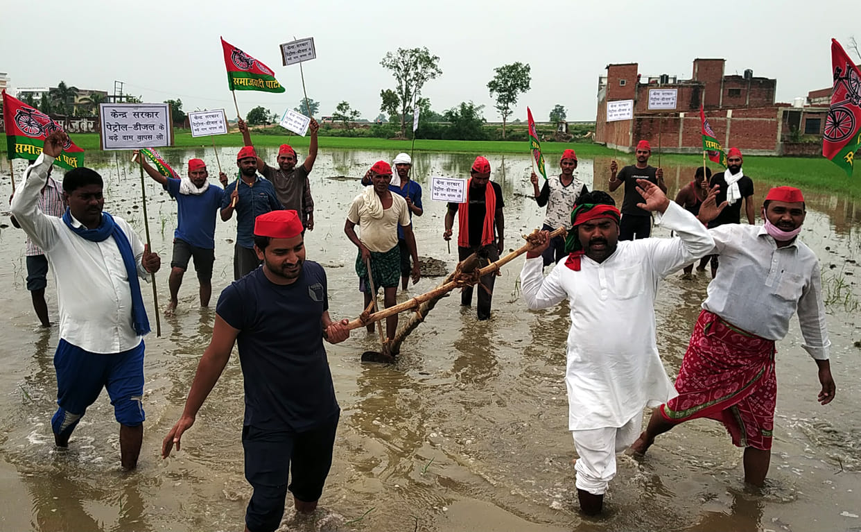 A procession, burnt effigy in protest against petrol and diesel price hike