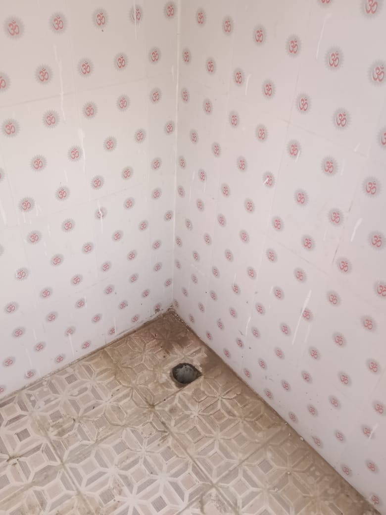 Tiles with religious symbols installed in toilet of Panchayat Bhavan in Jaunpur