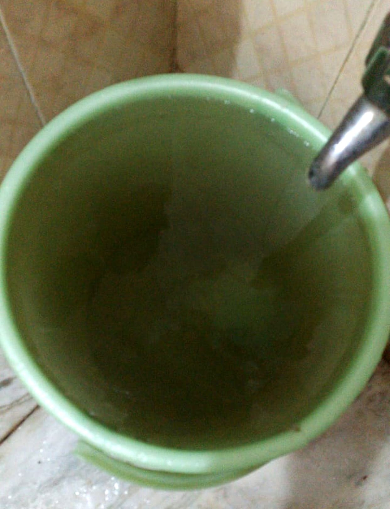 Dirty water coming from the tap in Awas vikas colony.