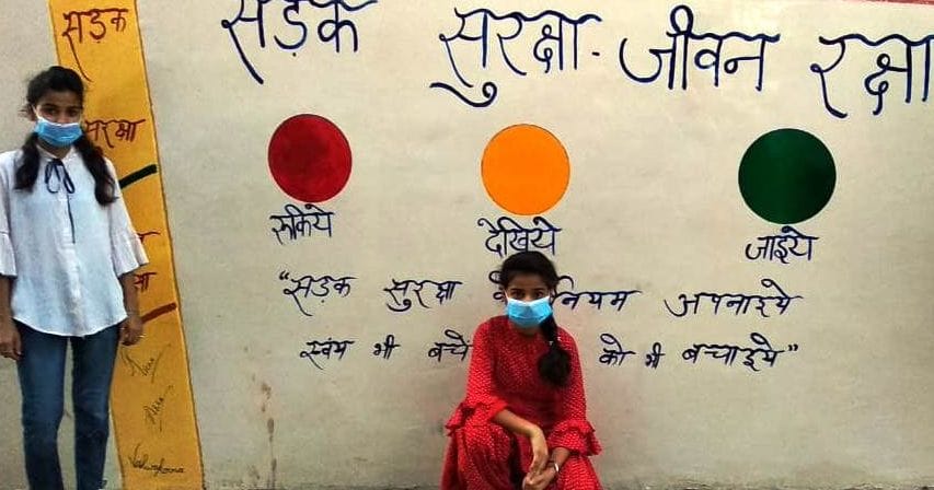 Girls made painting of traffic rules