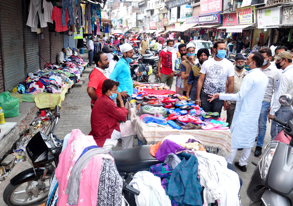Traders outraged by hawkers sitting outside closed shops