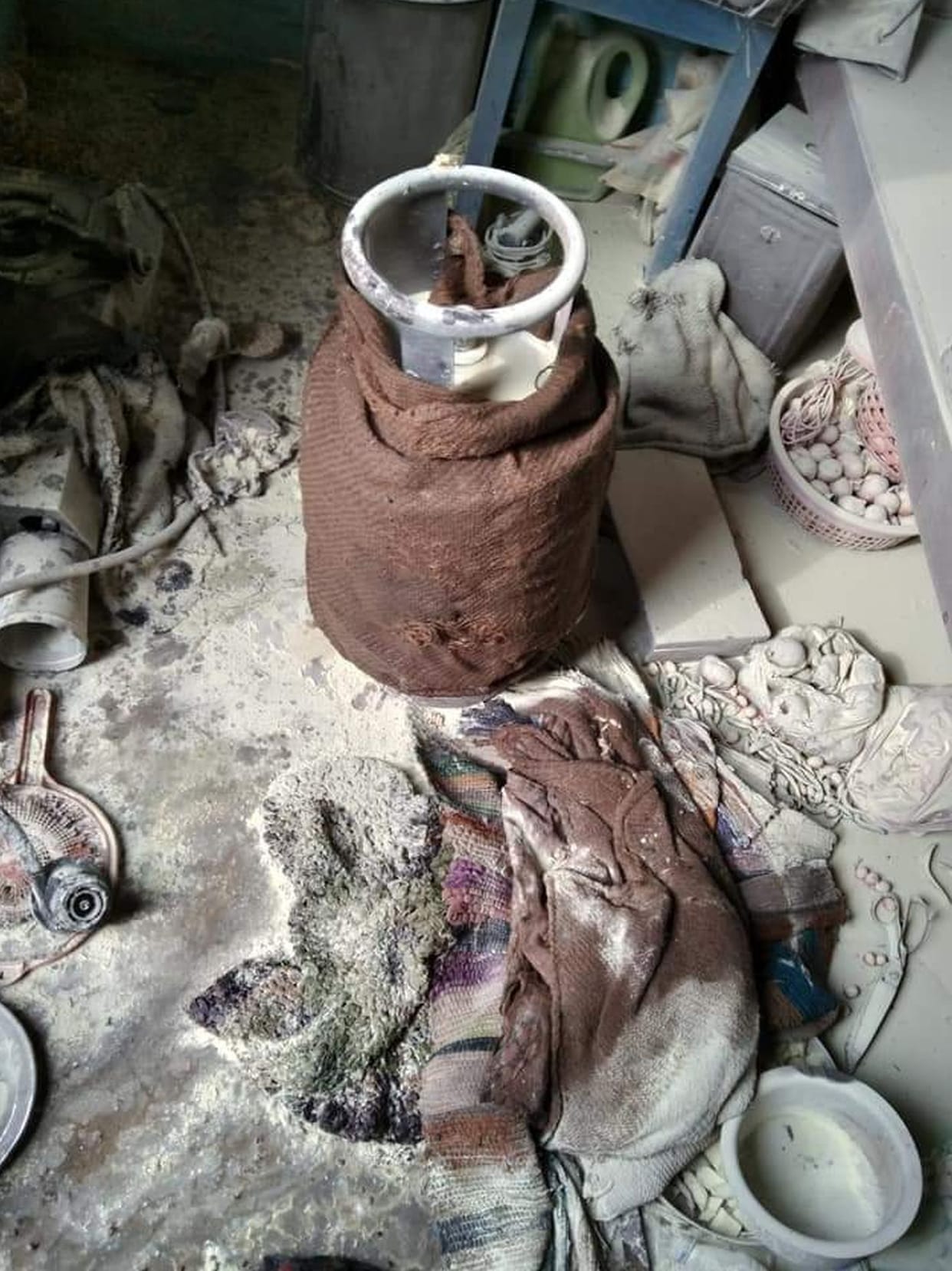 Ashes from fire in cylinder making tea