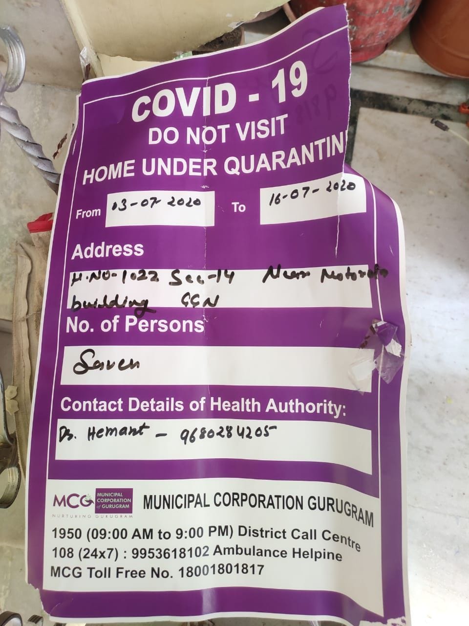 report negative but poster of corona positive pasted  outside of home