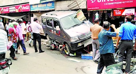 Uncontrolled to save bike rider, entered car shop