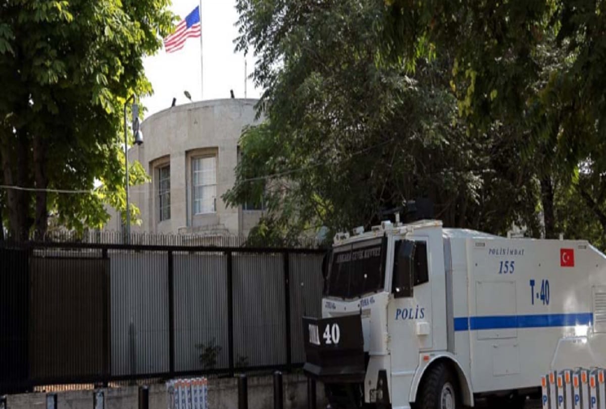 The professor was roaming around the embassy in the wish of work in America