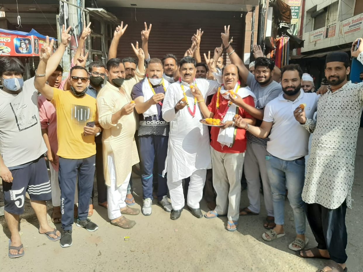 Sweets distributed on permission to open markets on both sides
