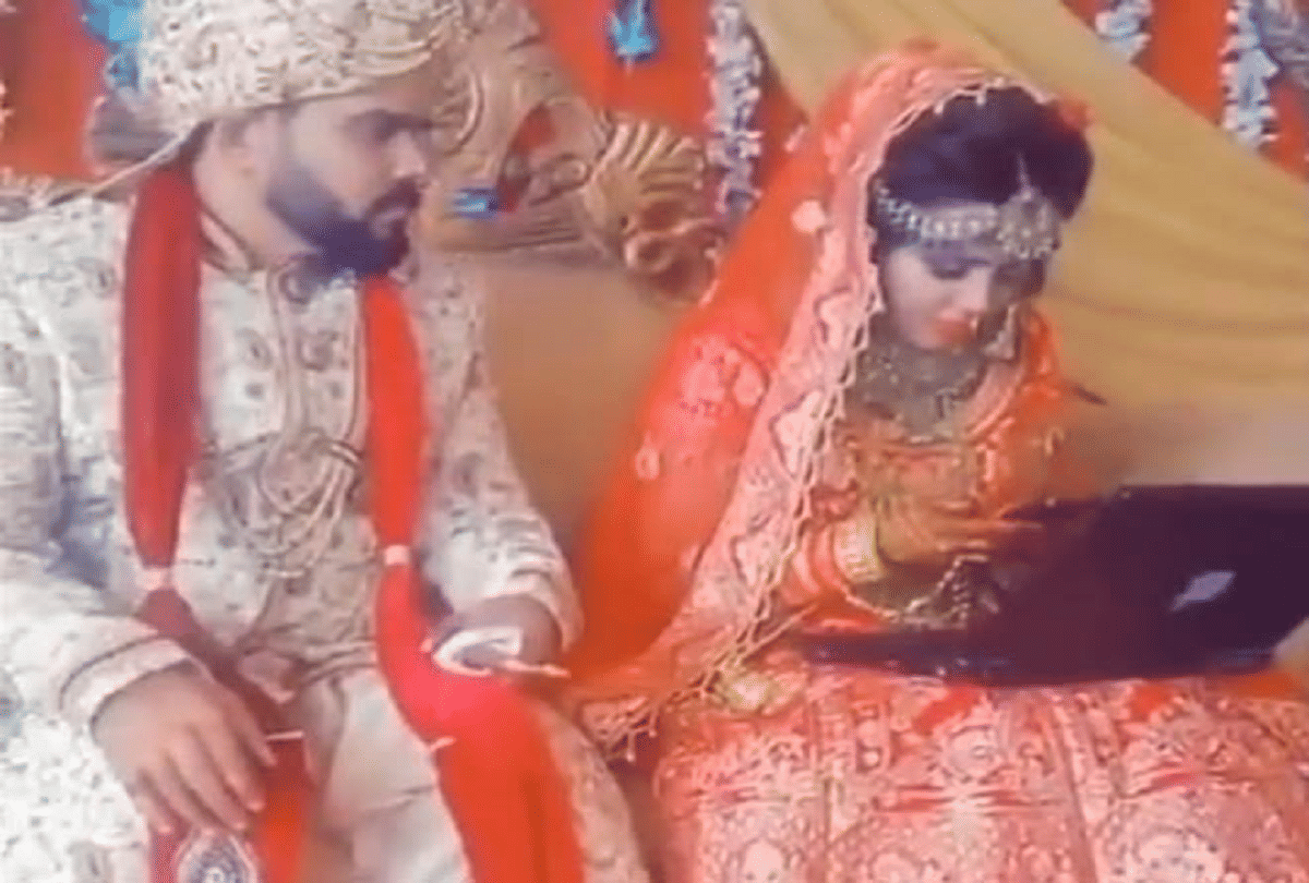 weird wedding bride doing office work on stage video goes viral