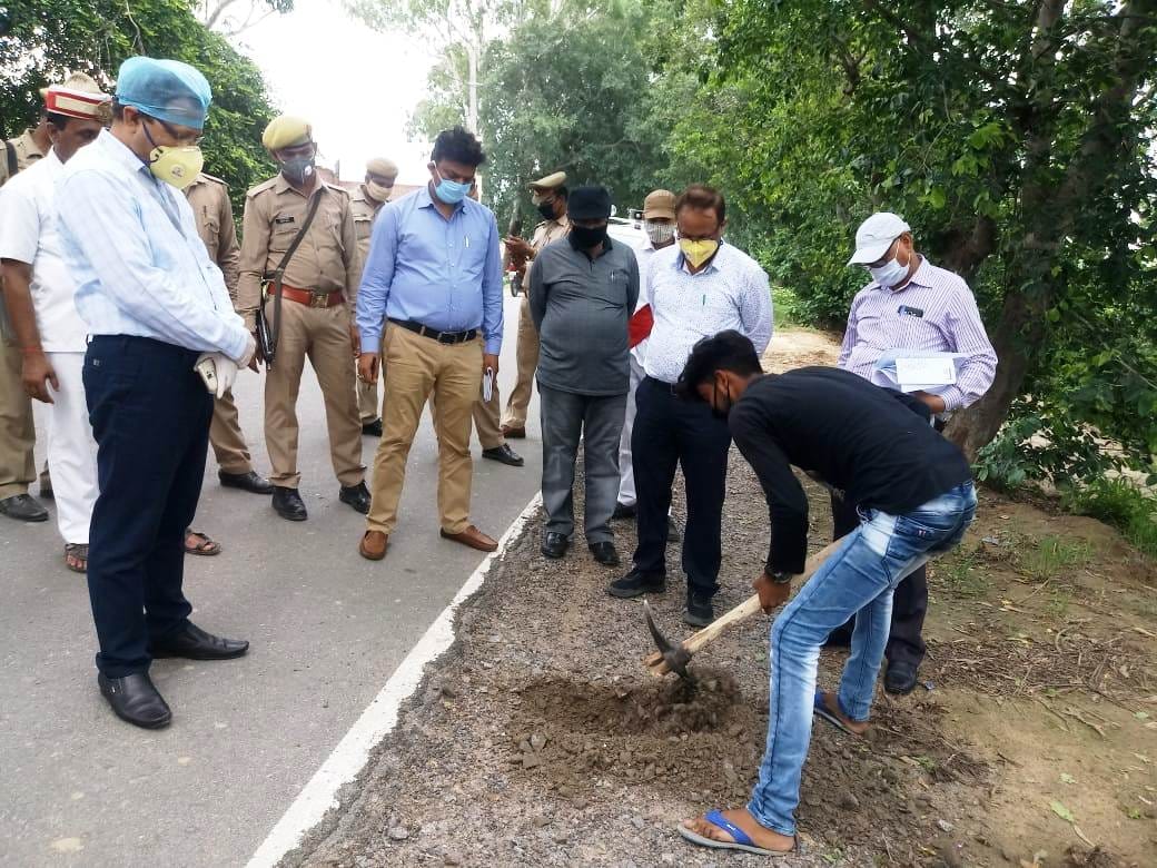 DM examines the quality of the excavated road under construction