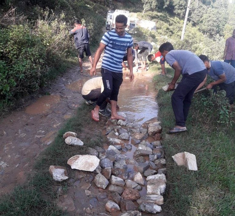 Villagers forced to fill the pits of stripe and road