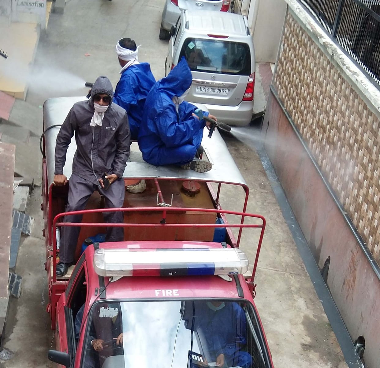 Fire brigade employees sprayed sanitizer