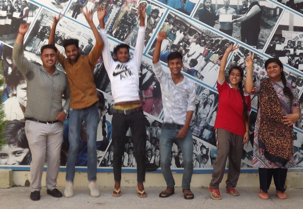 The meritorious jumped with joy after seeing the result