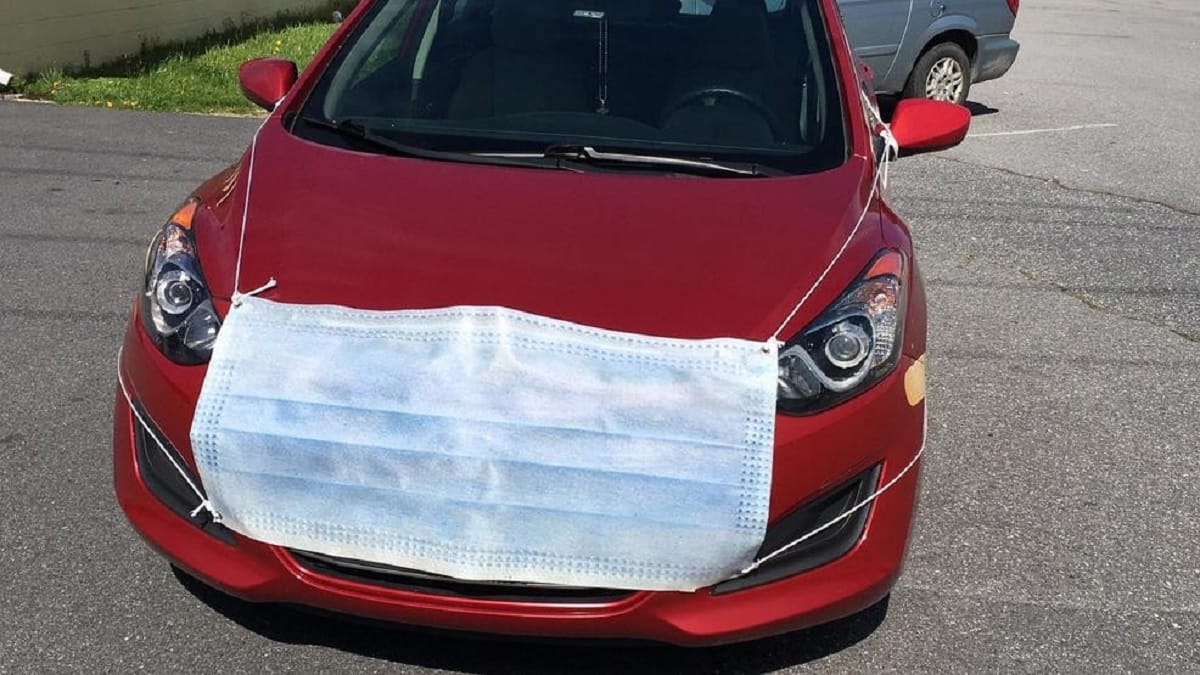 To promote used car sales during covid 19, dealer made dressed a mini cooper car in a mask