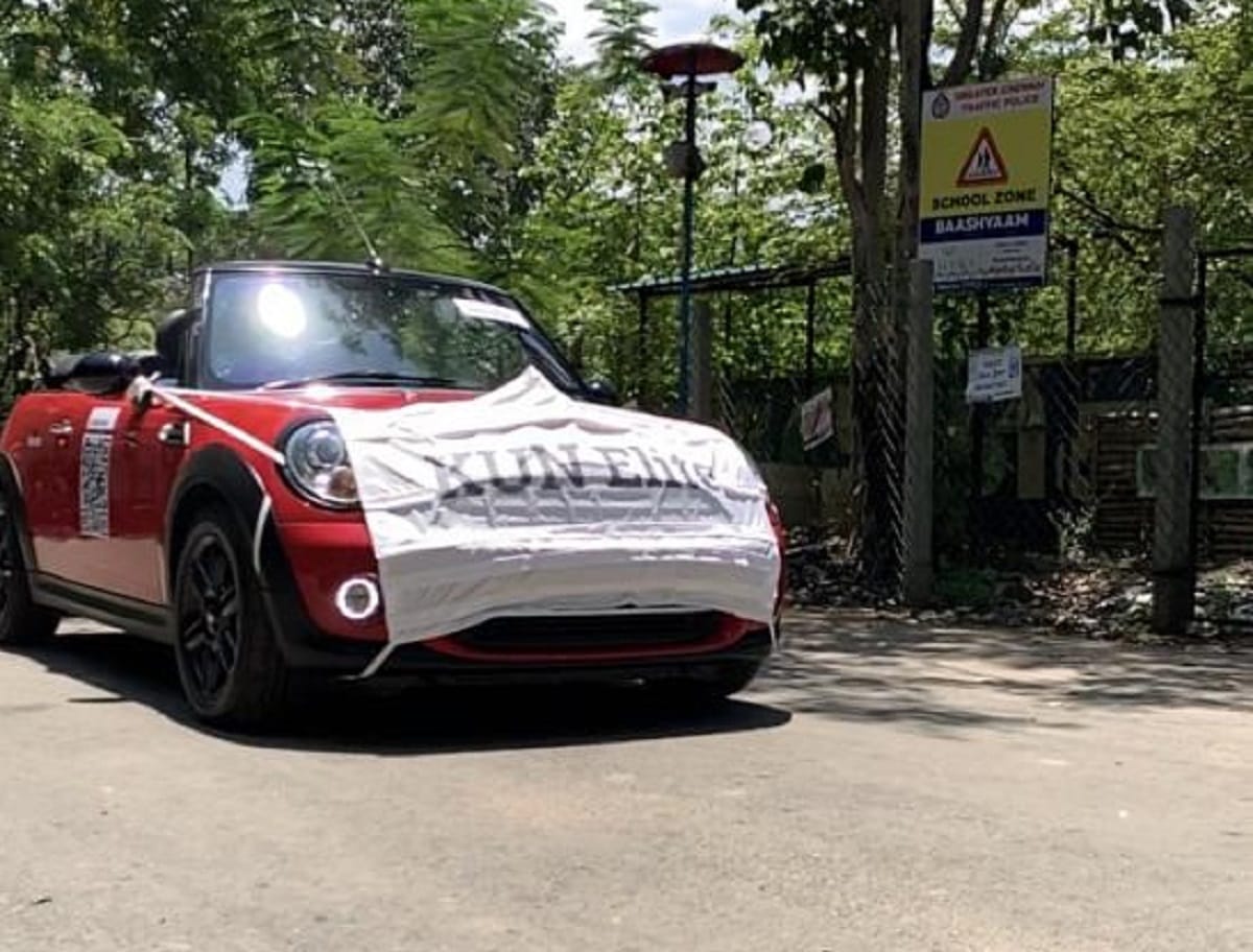To promote used car sales during covid 19, dealer made dressed a mini cooper car in a mask