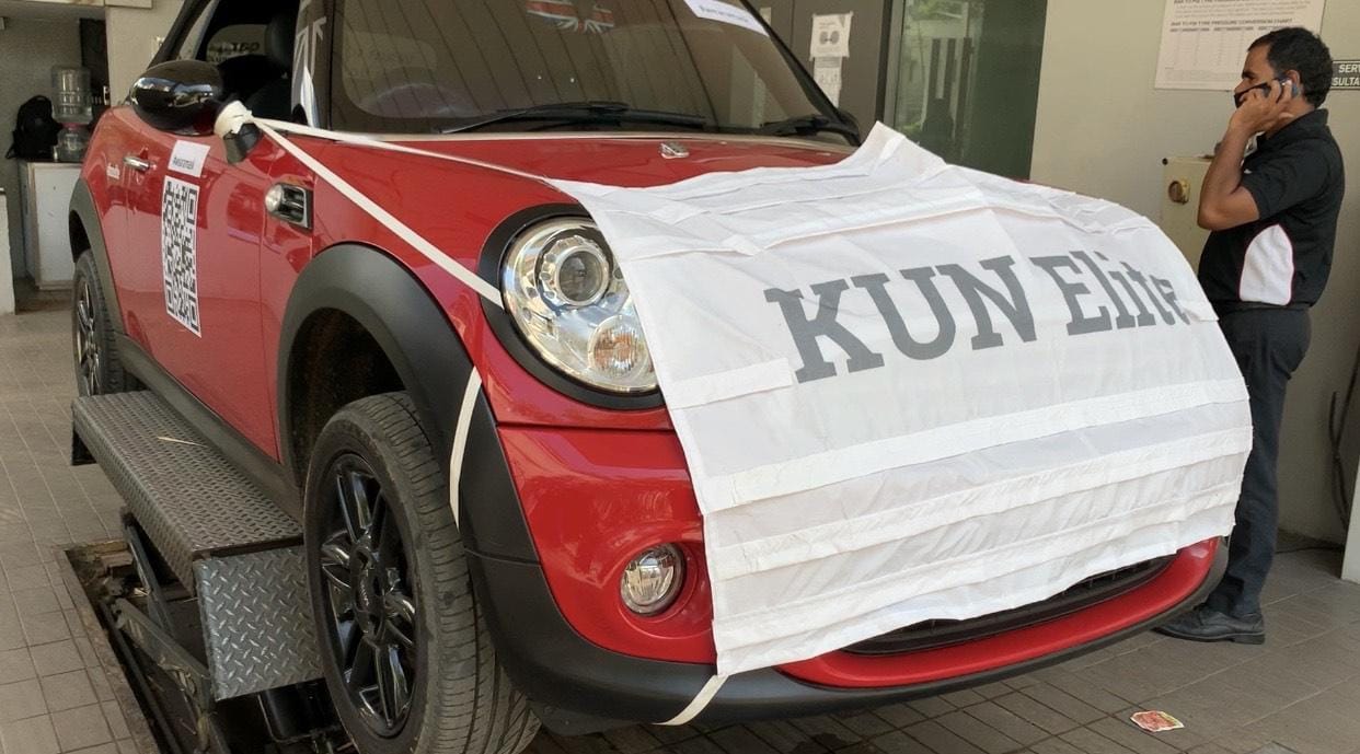To promote used car sales during covid 19, dealer made dressed a mini cooper car in a mask