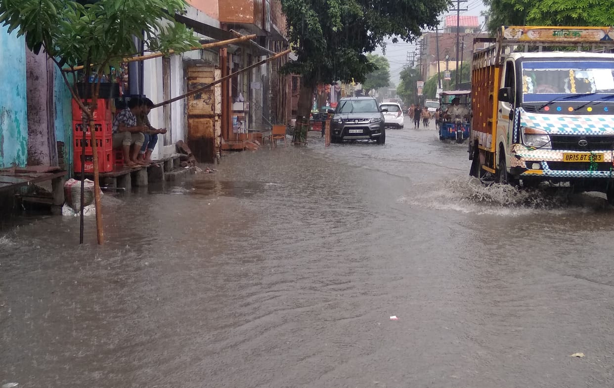 in the heavy rain the sever over flow and the water fill in the road