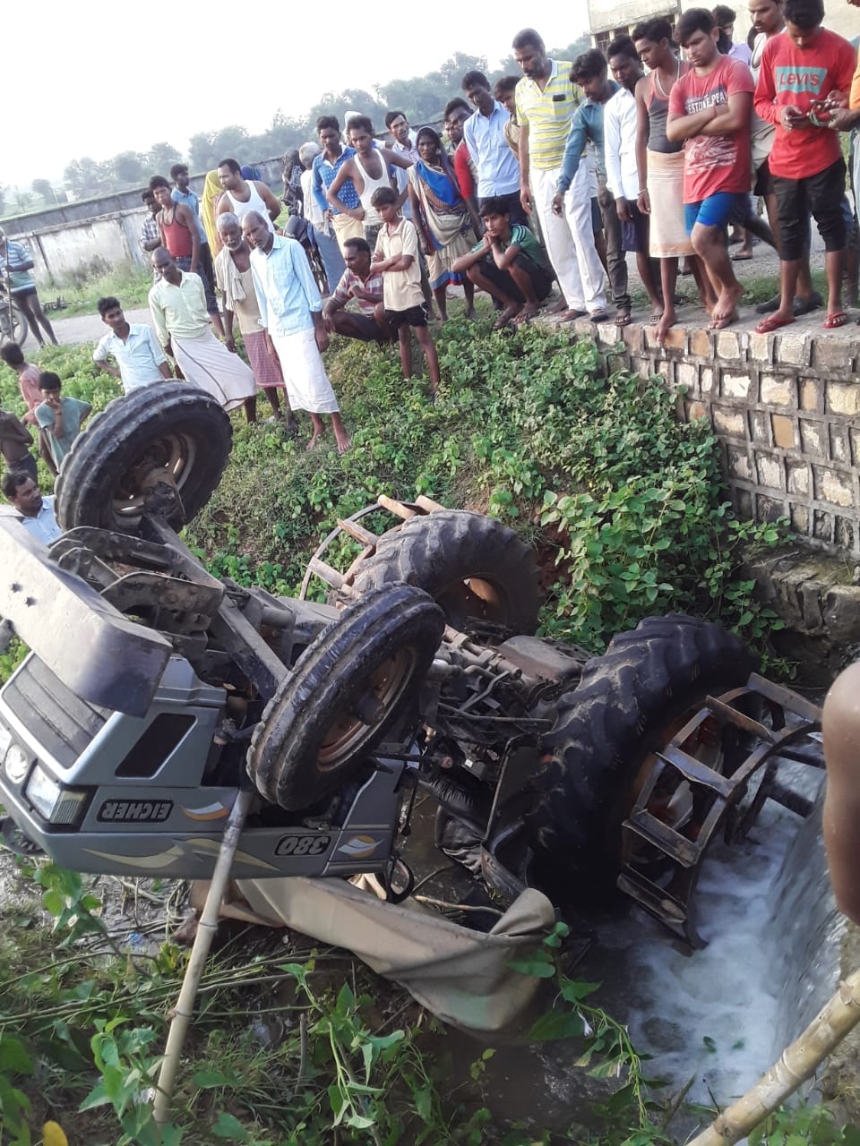 Tractor overturns while backing driver injured in mirzapur