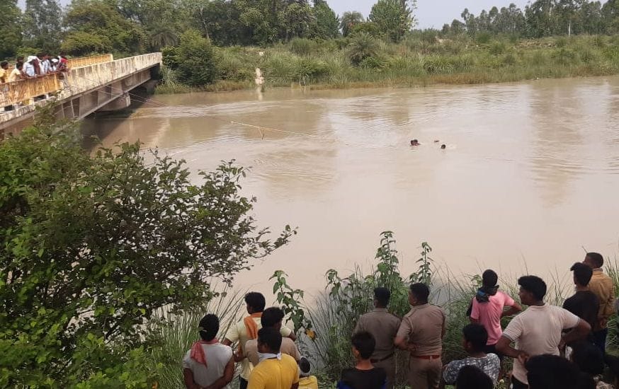 a teen put down in buggi and  girls jump into river