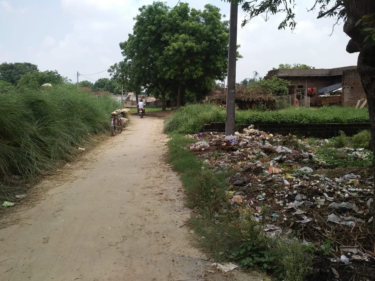 Roadside dirt passers by walk hard in mirzapur