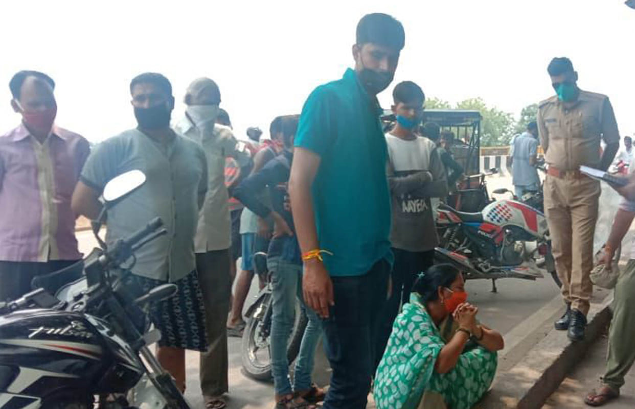 Old man hanged from railroad of highway bridge