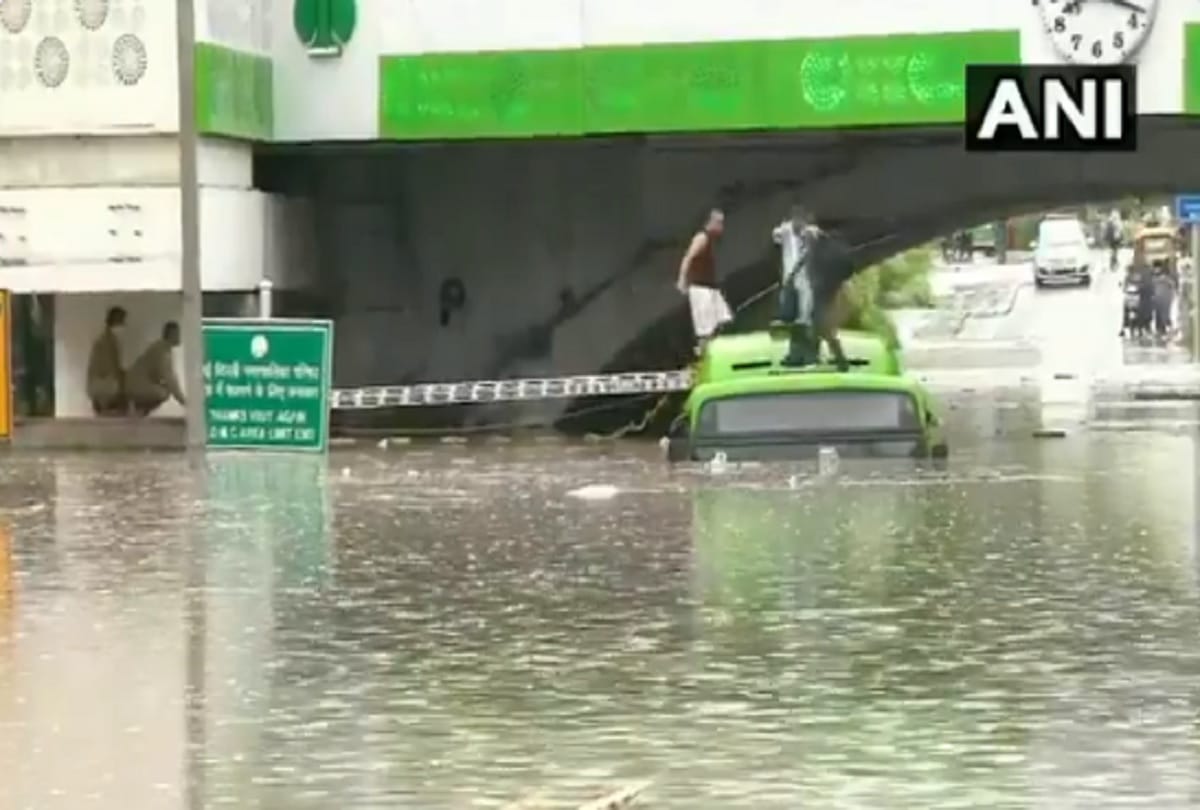 Heavy rain in Delhi DTC bus drowns at minto bridge see pictures