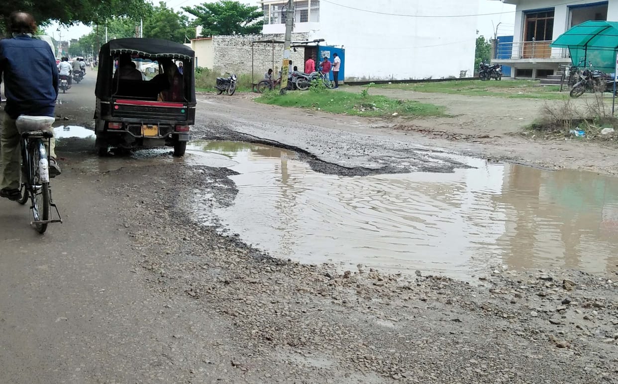 Pit of pothole road inviting accidents
