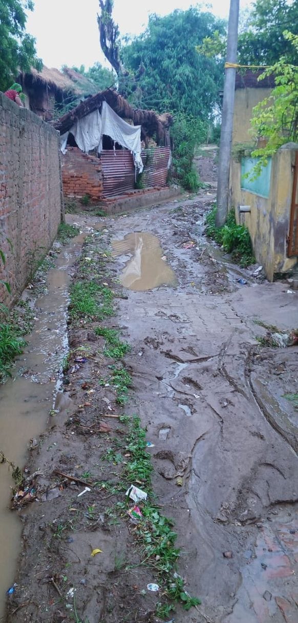 Villagers forced to walk through mud lanes