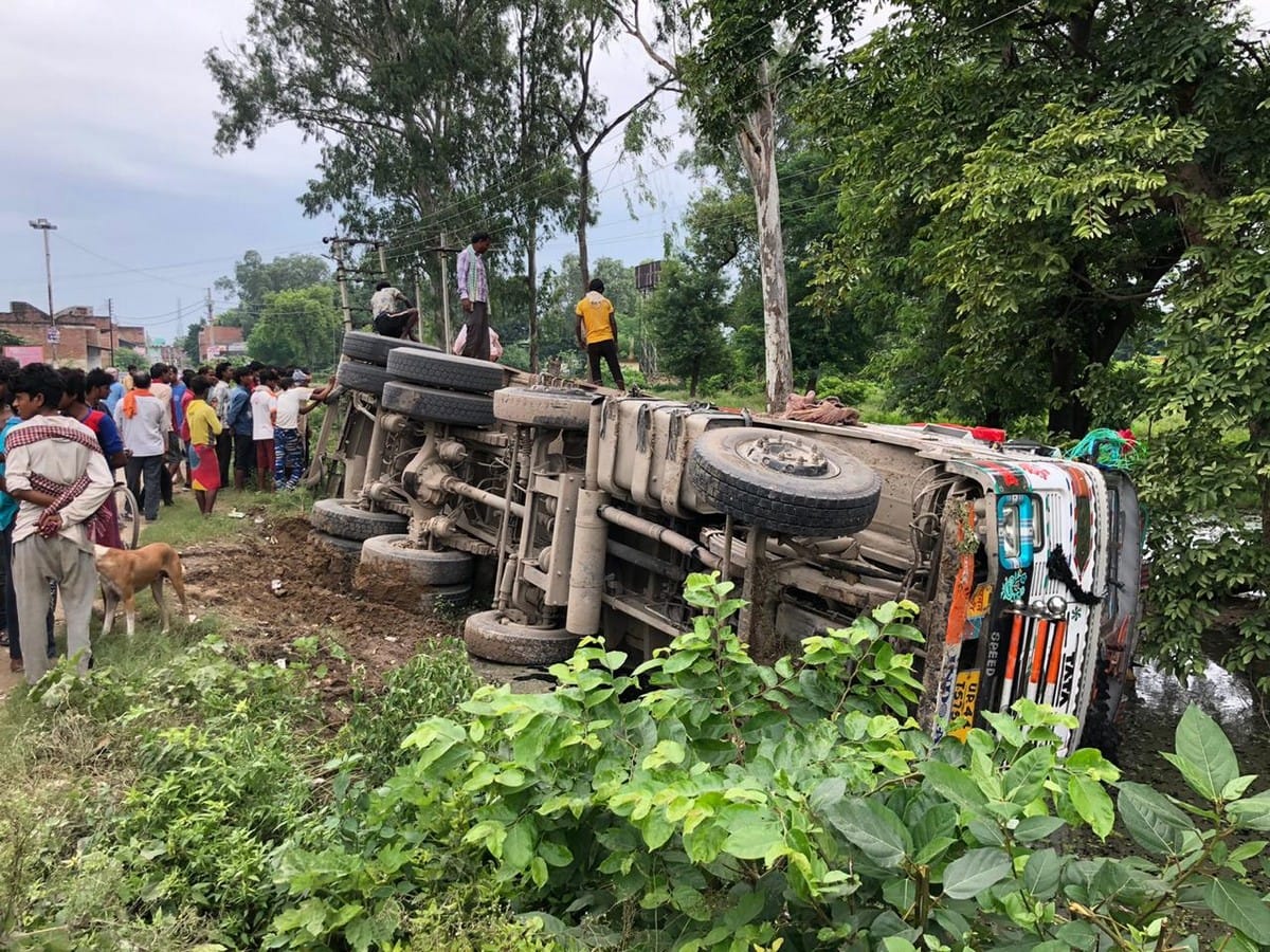 Cement over loaded truck overturns accident driver and conductor save in bhadohi up