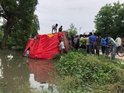 Cement over loaded truck overturns accident driver and conductor save in bhadohi up
