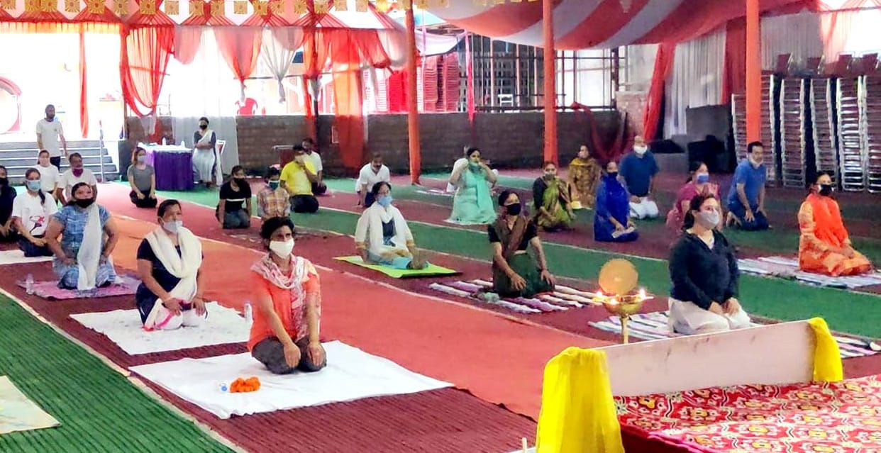 Ways of being free from yoga taught in camp