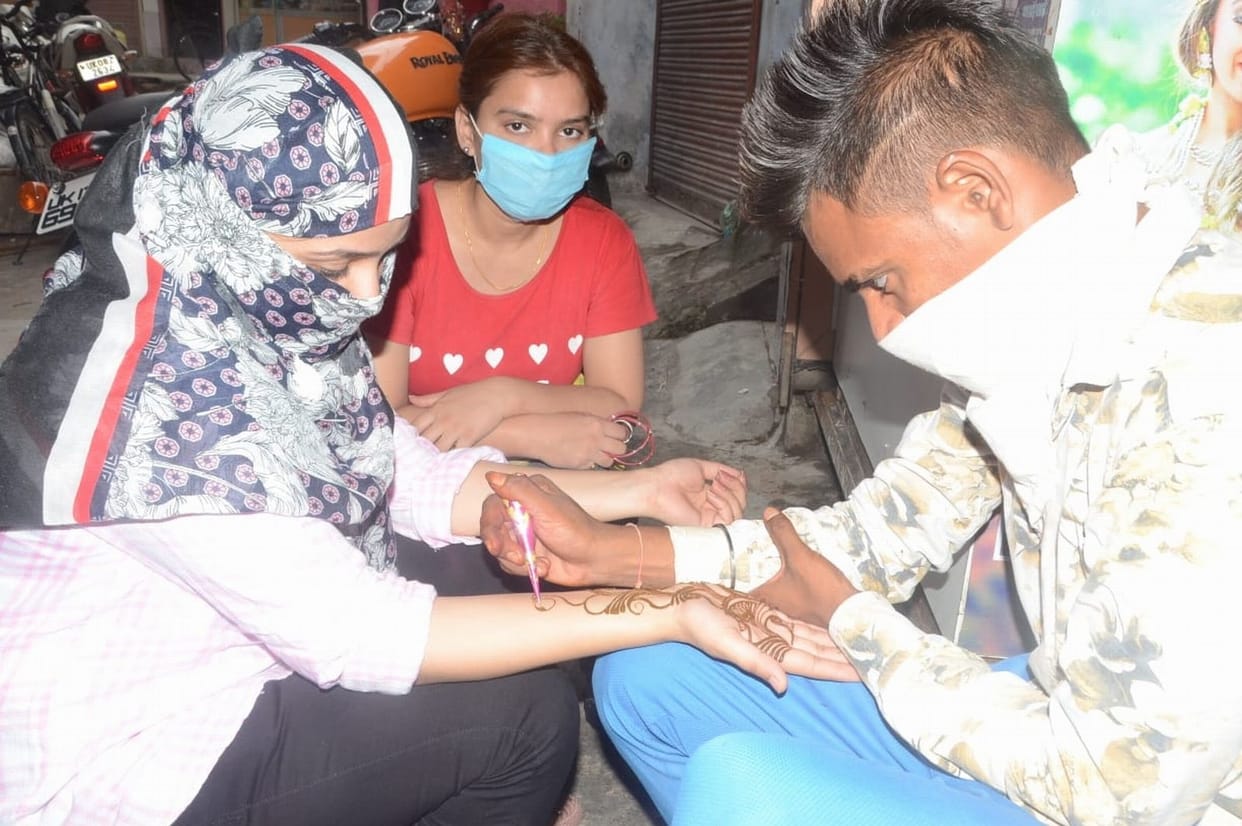 Mehndi decorated on hands for Teej Festival