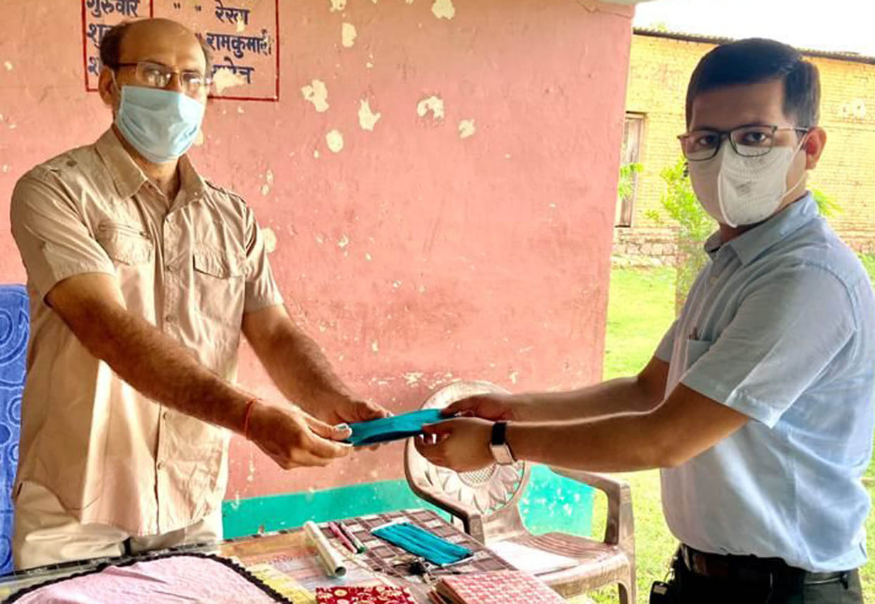In Lama village, students planted masks and distributed masks
