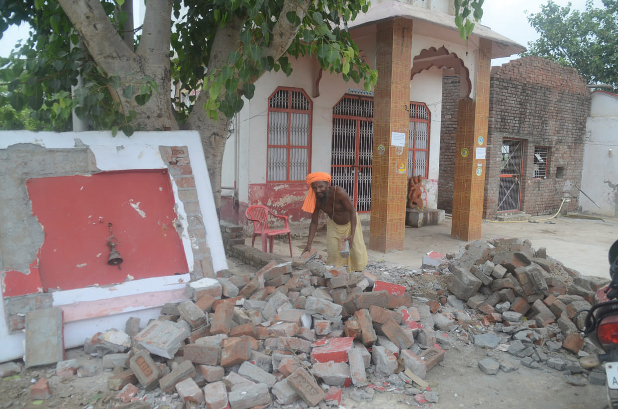 People removed the debris themselves in Katha, JCB on Shiva temple