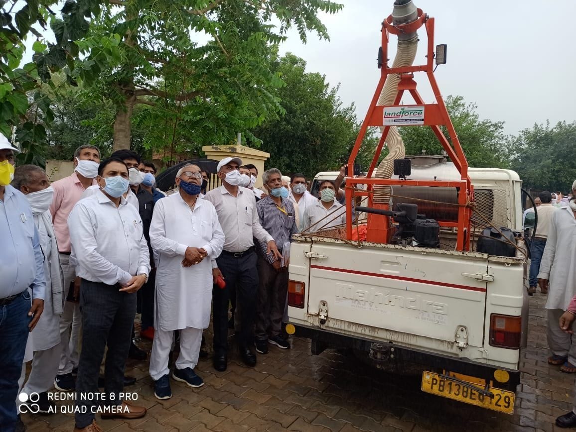 Demonstration of vehicle mounted fogging machine to kill grasshopper crew