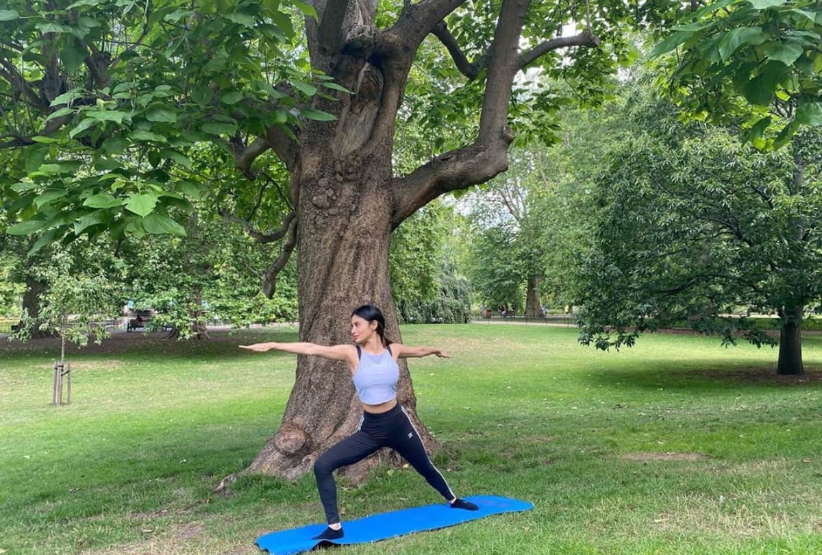 mouni roy pics latest doing yoga poses in garden glamorous look