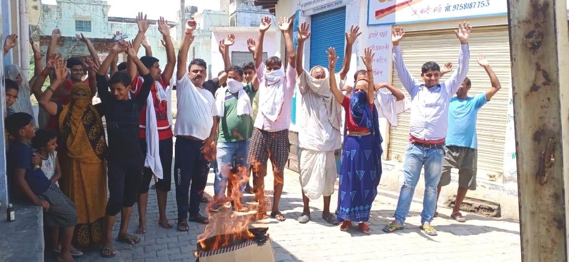 outrage over cuts, effigy of electricity department