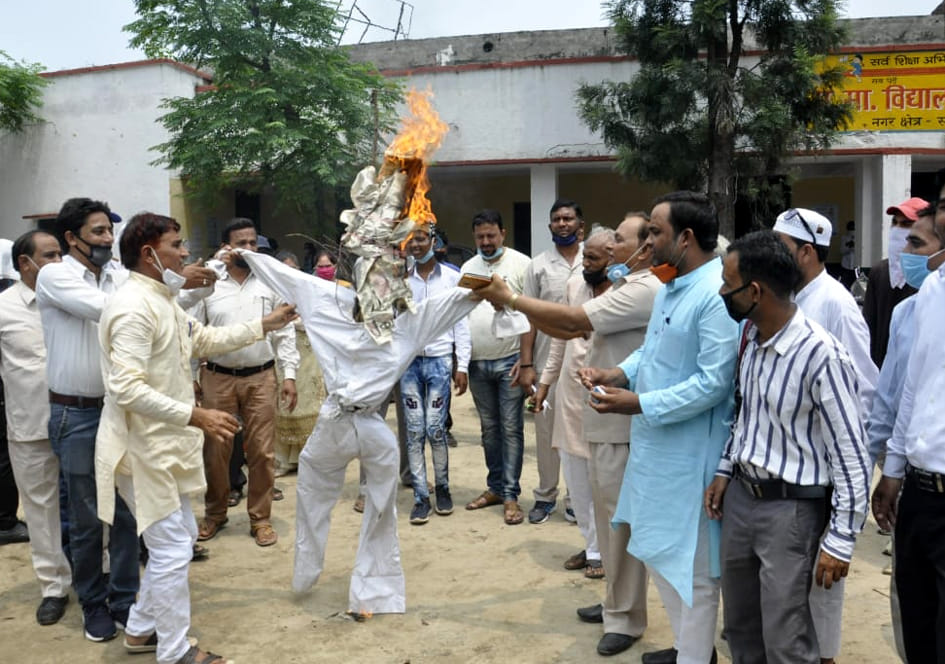 School operators burnt effigy of education officer