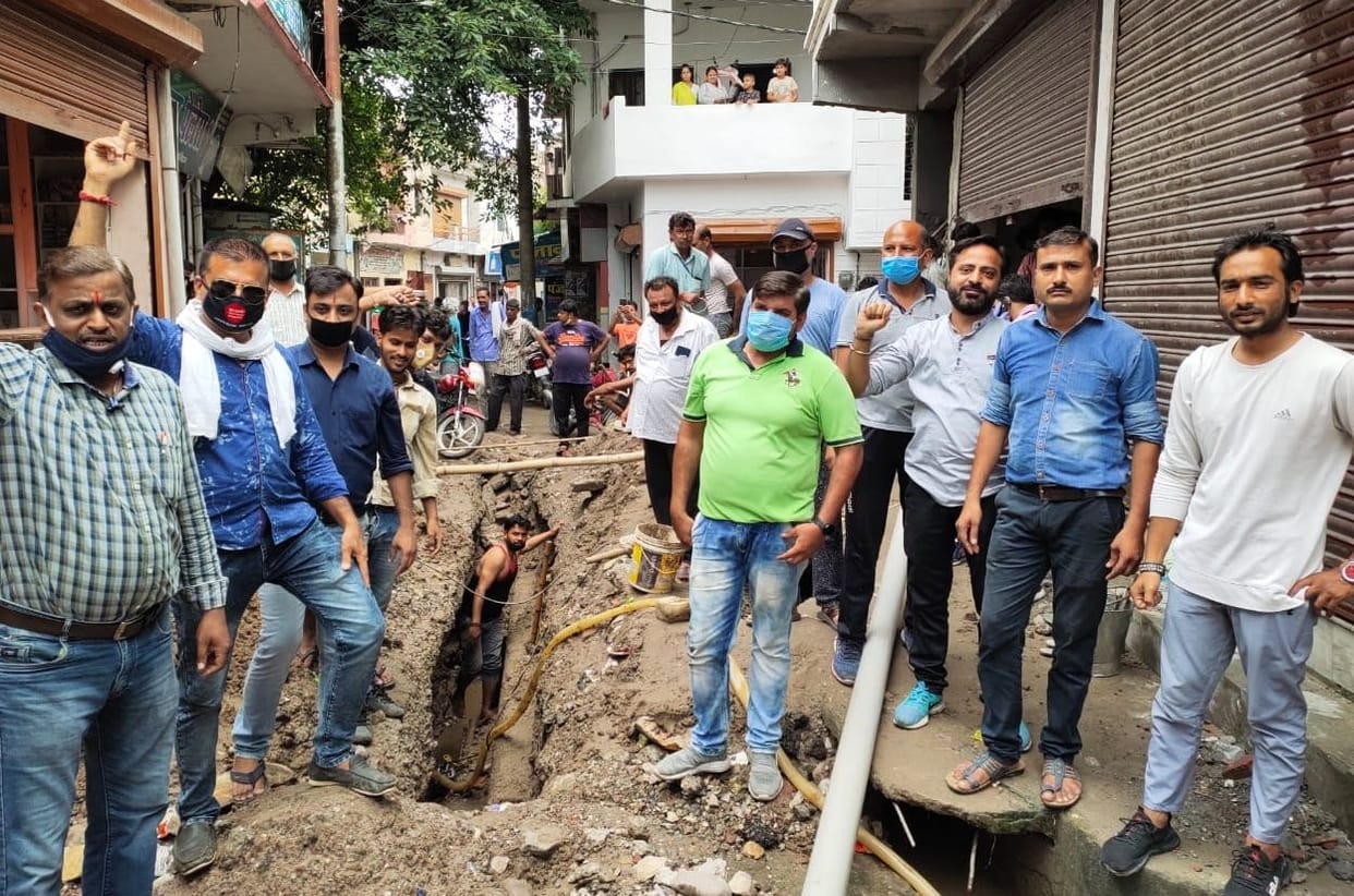 Traders protest against pits dug in the streets
