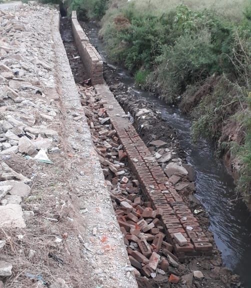 Wall of main drain made from old bricks