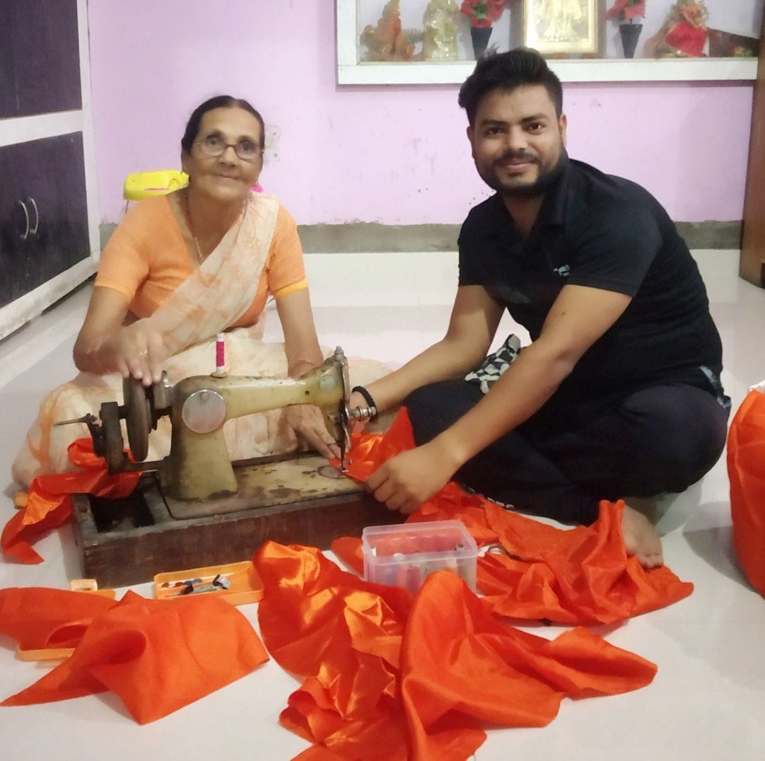 Women prepairing bhagva flag