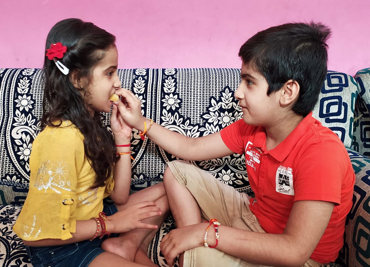 Rakhi tied,on brother's,wrist,promise of protection