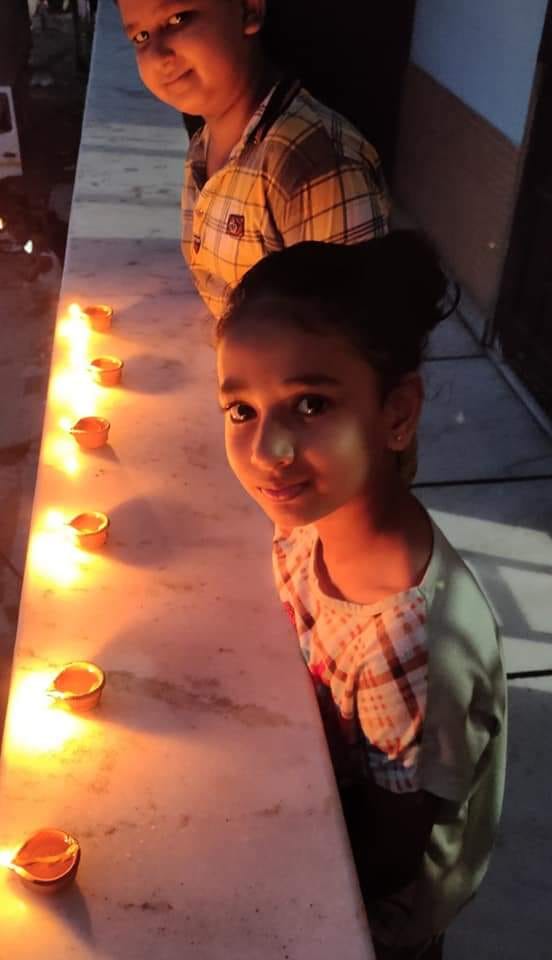The temple shines with colorful lights, lighting the lamp