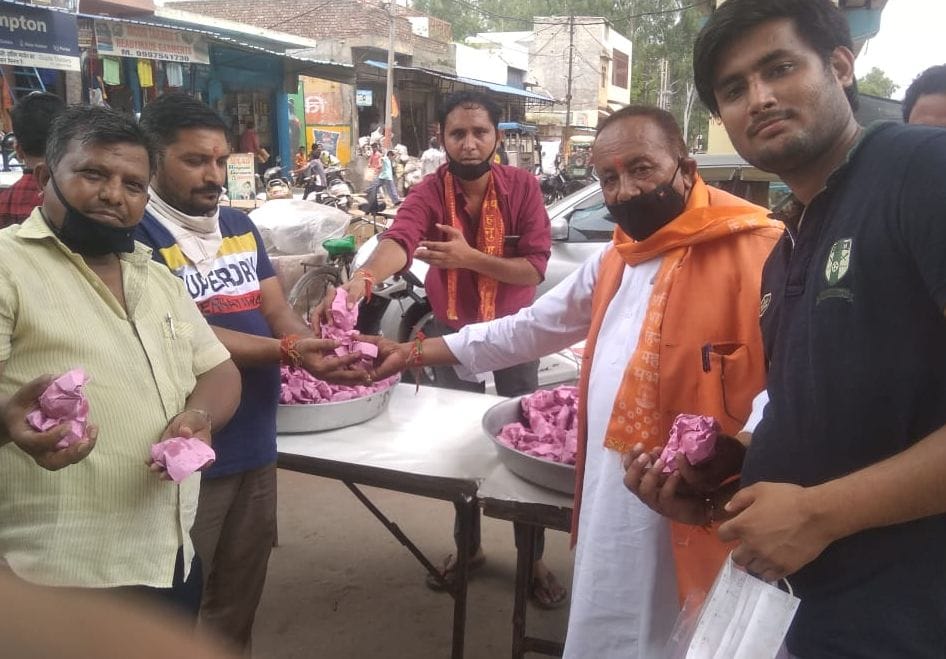the shopkeepers distribute laddu for happes ness of shri ram mandir temple at aayodhiya