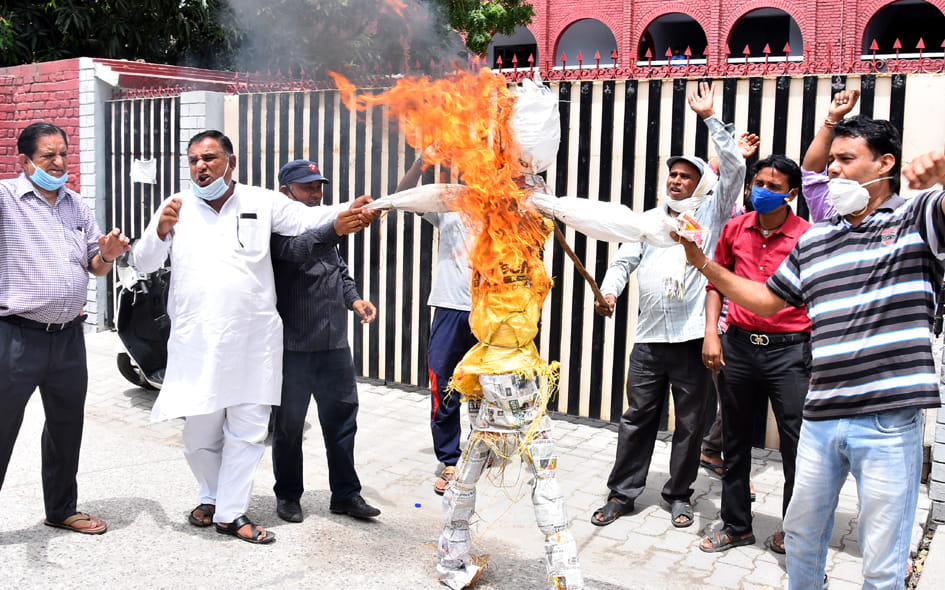 School operator's effigy burnt in front of school