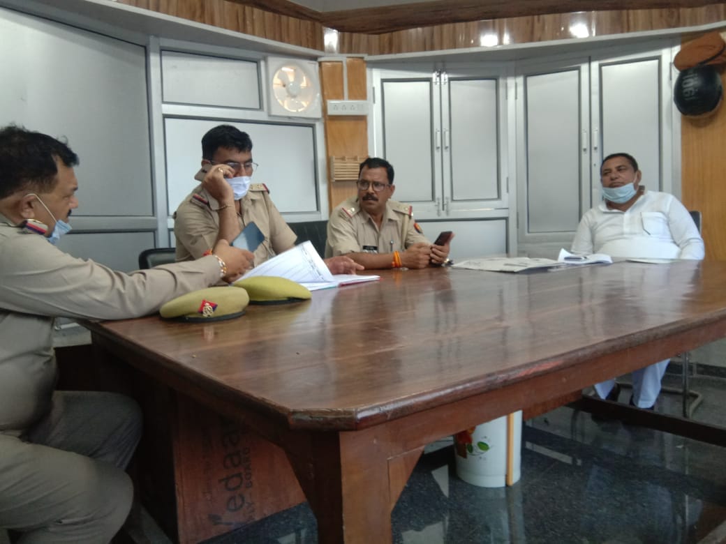 Parents Conflict Committee officials sit at the police station