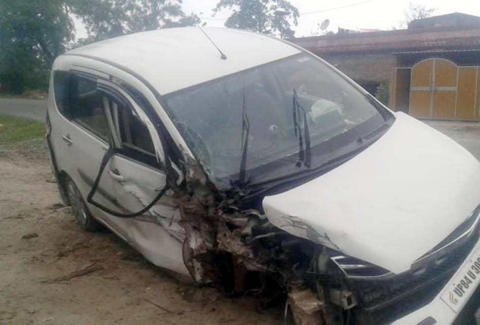Collision between car and pickup, both vehicles damaged