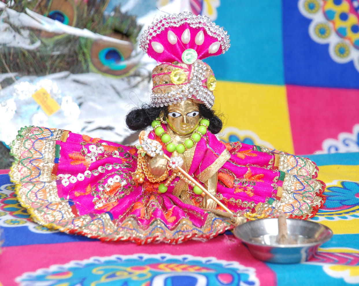 Will wear colorful dress, swing in silver cradle